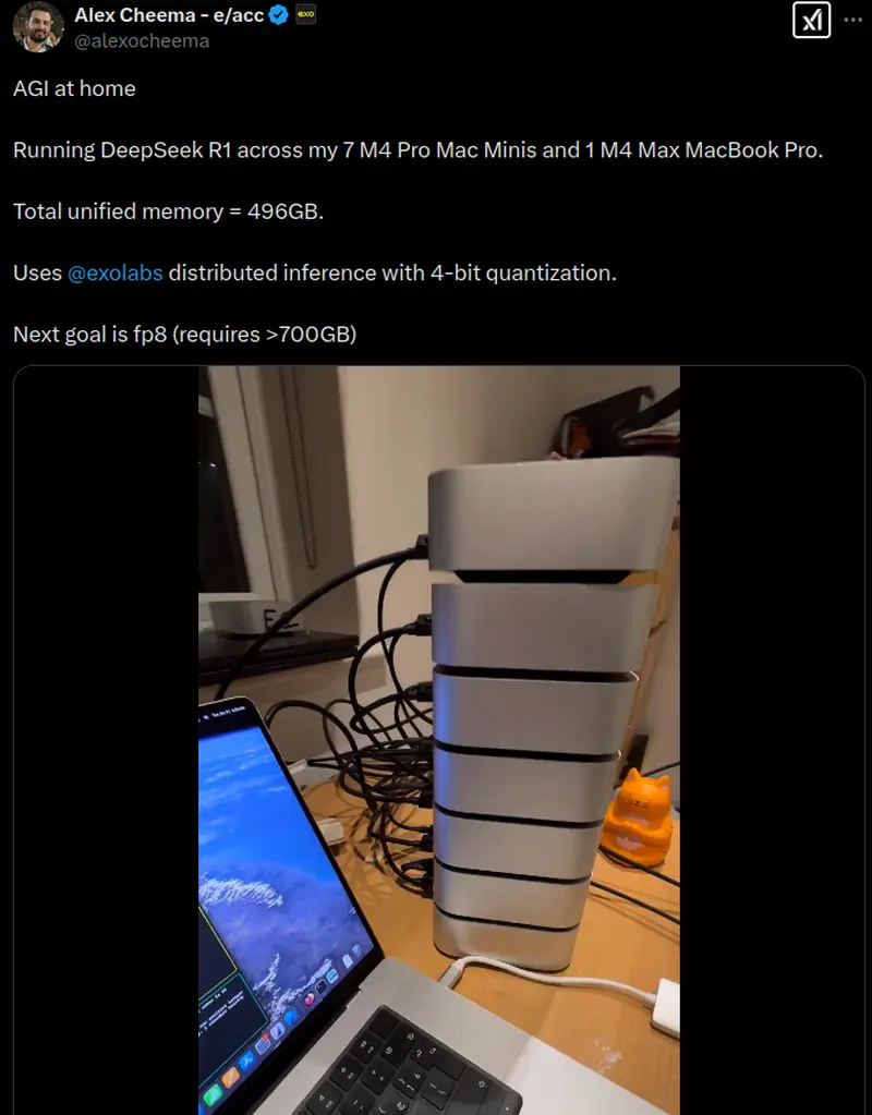 Screenshot of the post made by user alexocheema on twitter (x.com), message says: AGI at home. Running DeepSeek R1 across my 7 M4 Pro Mac Minis and 1 M4  Max Macbook Pro Total. Total unified memory = 496Gb. Uses exolabs distributed inference with 4-bit quantization. Next goal is fp8 (requires >700Gb). There is also photo of 7 mac minis stacked on top of each other near macbook.